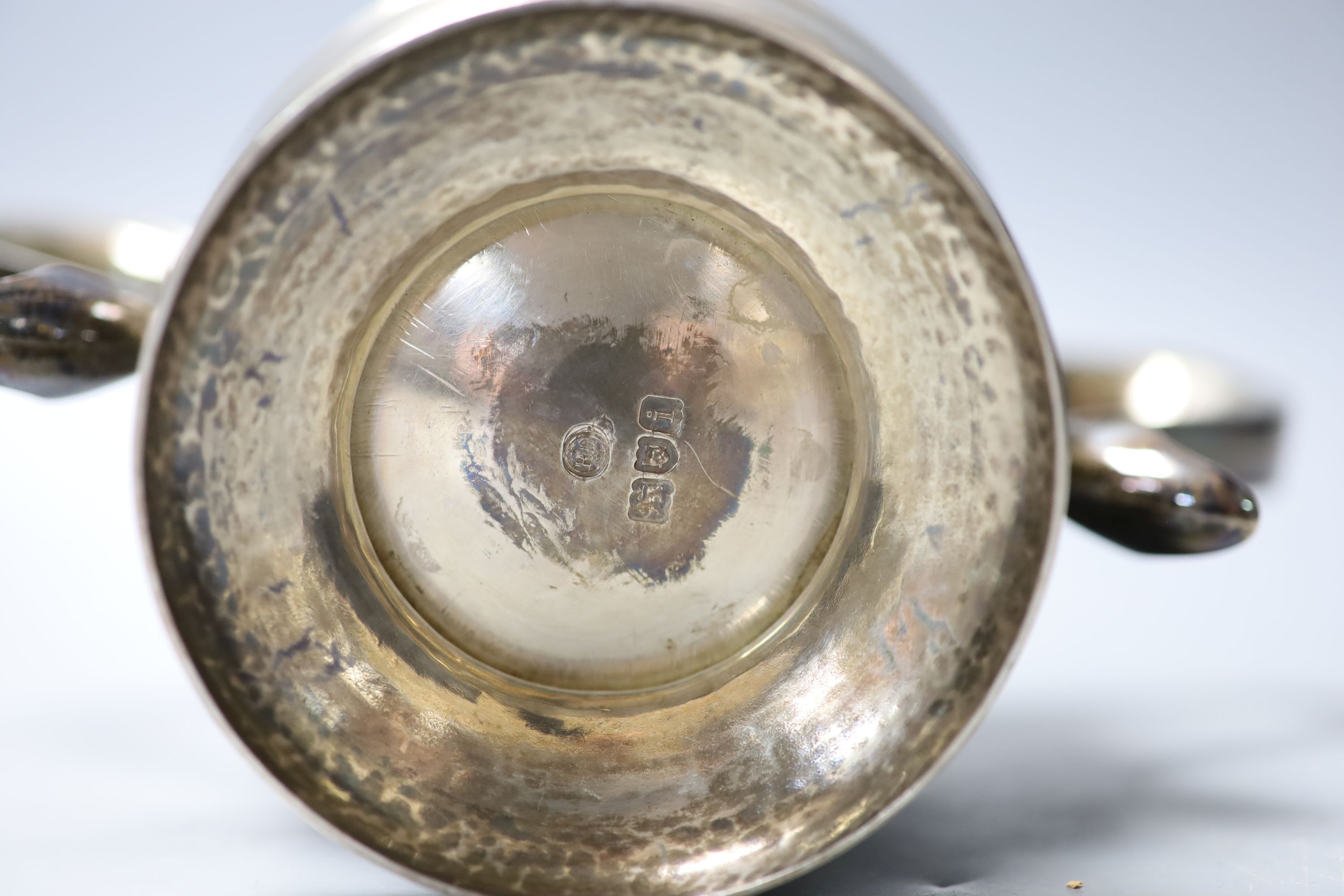 An Edwardian silver two handled trophy cup, with banded girdle, Robert Dicker, London, 1904, height 14.4cm, 19.5oz.